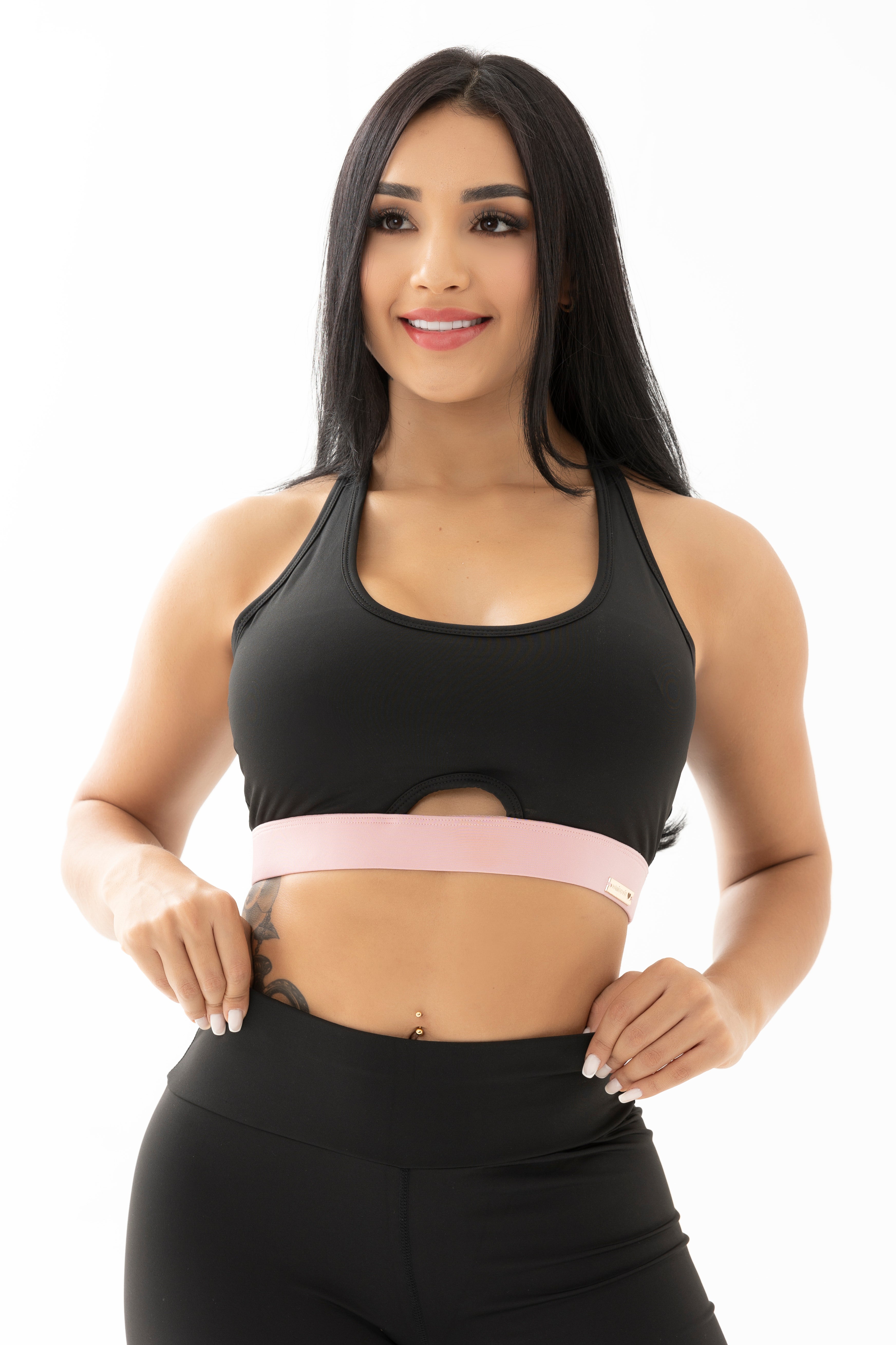 Conjunto negro y rosado de tres piezas con chompa, top y leggings